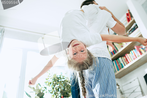 Image of Father and his six years kid girl at home