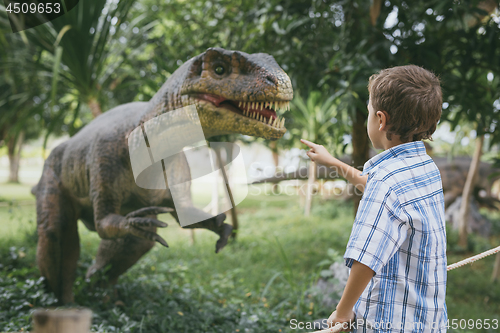 Image of little boy playing in the adventure dino park.