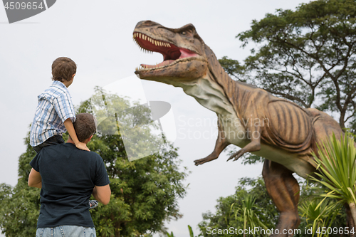 Image of Father and son playing in the adventure dino park.