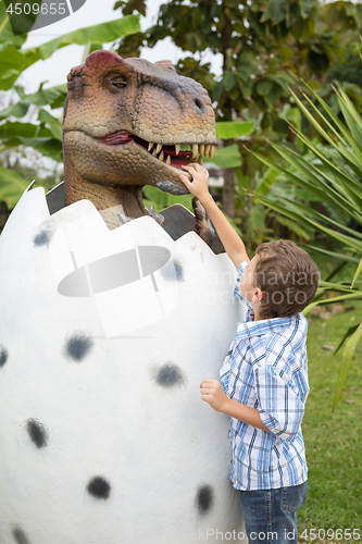 Image of little boy playing in the adventure dino park.