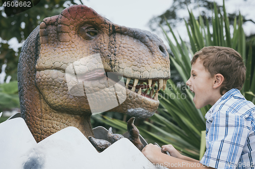 Image of little boy playing in the adventure dino park.