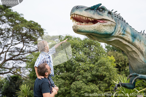 Image of Father and son playing in the adventure dino park.