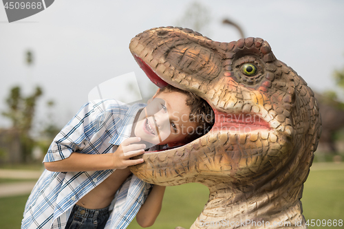 Image of little boy playing in the adventure dino park.