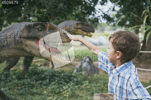 Image of little boy playing in the adventure dino park.