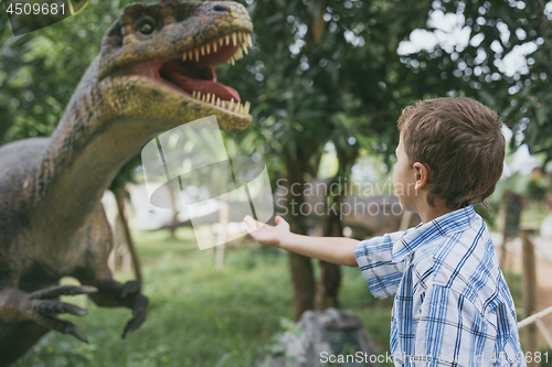 Image of little boy playing in the adventure dino park.