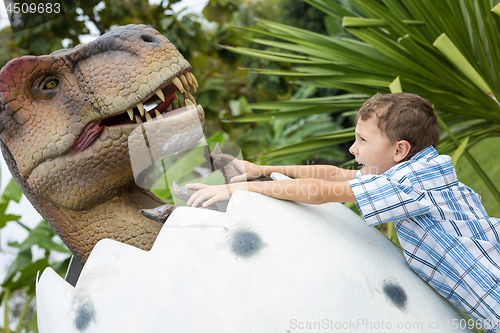 Image of little boy playing in the adventure dino park.