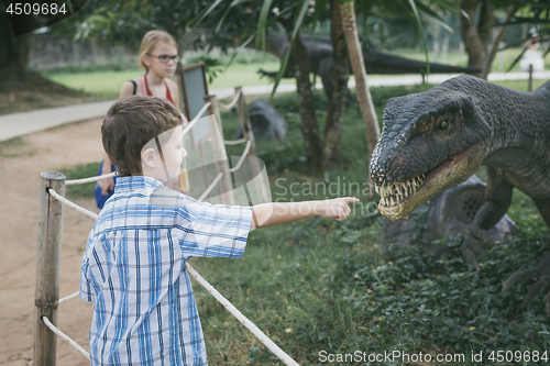 Image of little boy playing in the adventure dino park.