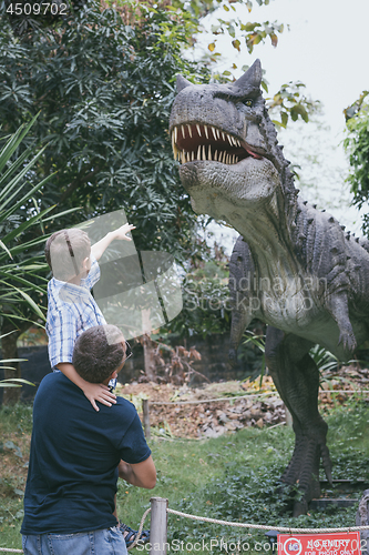 Image of Father and son playing in the adventure dino park.