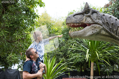 Image of Father and son playing in the adventure dino park.