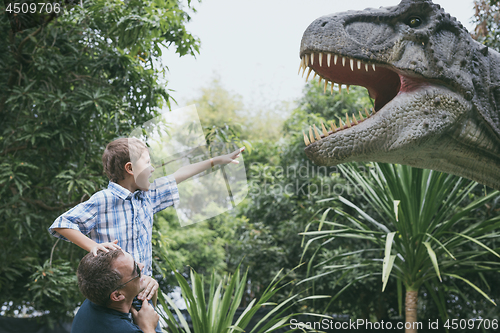 Image of Father and son playing in the adventure dino park.