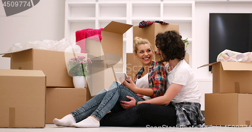 Image of young couple moving  in new house