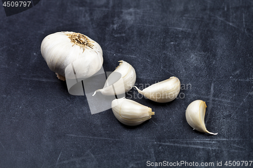 Image of Fresh raw organic garlic on black board