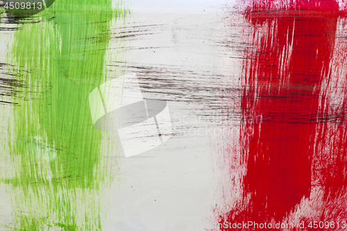Image of Italian flag painted with  brush strokes on white background.