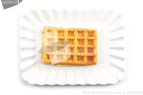 Image of Belgium waffer on ceramic plate isolated on white background.