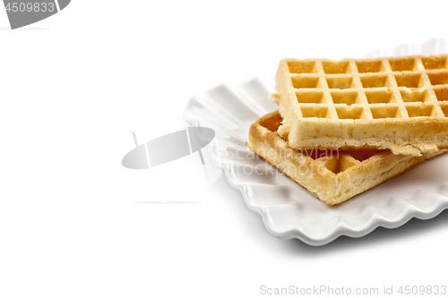 Image of Belgium waffers on white ceramic plate isolated on white backgro