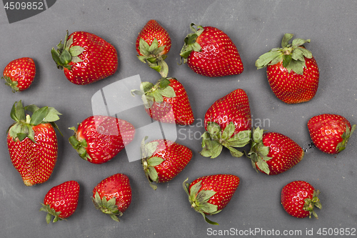 Image of Fresh ripe strawberries on black background.