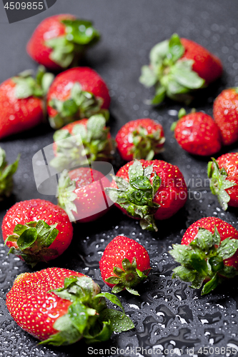 Image of Fresh ripe strawberry with water drops closeup.