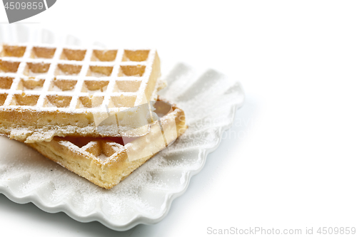 Image of Belgium waffers with sugar powder on ceramic plate isolated on w