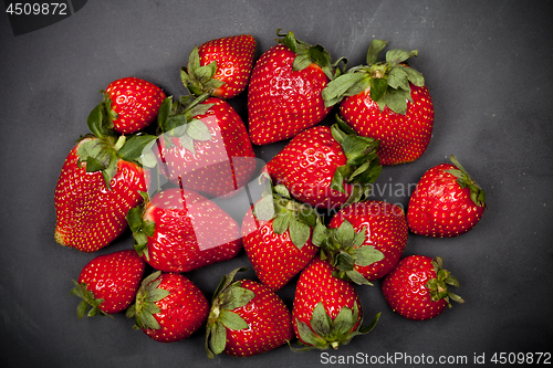 Image of Fresh ripe strawberries on black background.