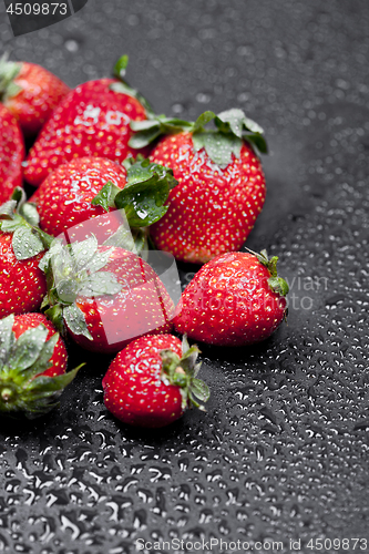 Image of Fresh ripe strawberry with water drops closeup.