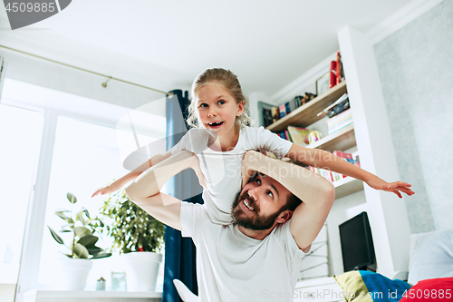 Image of Father and his six years kid girl at home