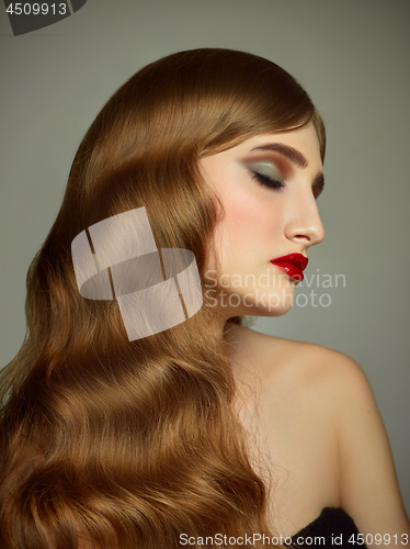 Image of Close-up indoor portrait of lovely girl with colorful hair. Studio shot of graceful young woman with long haircut