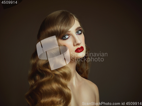 Image of Close-up indoor portrait of lovely girl with colorful hair. Studio shot of graceful young woman with long haircut