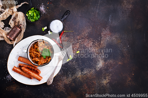 Image of sausages with cabbage