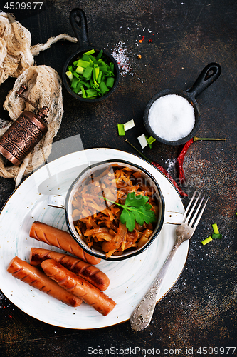 Image of sausages with cabbage