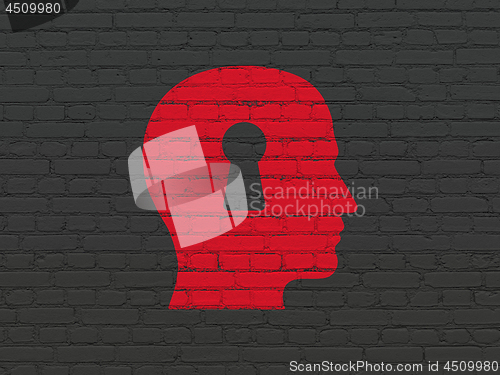 Image of Finance concept: Head With Keyhole on wall background
