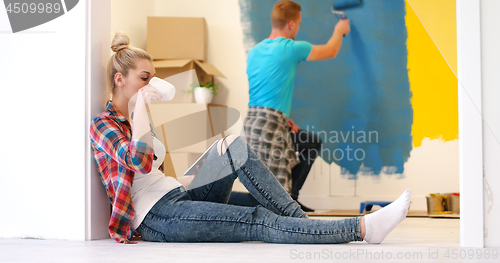 Image of couple doing home renovations