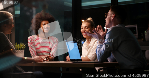 Image of Multiethnic startup business team in night office