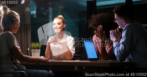 Image of Multiethnic startup business team in night office