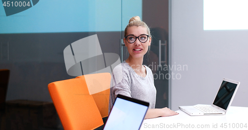 Image of businesswoman using a laptop in startup office