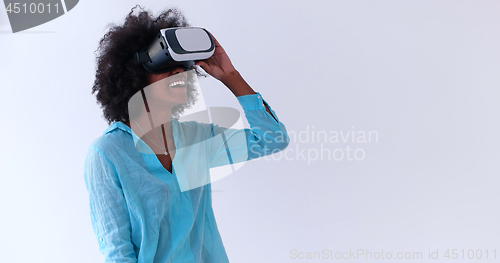 Image of black girl using VR headset glasses of virtual reality