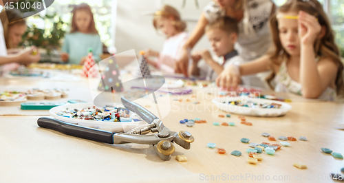 Image of Girl birthday decorations. table setting with cakes, drinks and party gadgets.