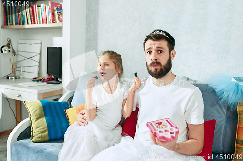 Image of Father and his six years kid girl at home