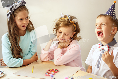 Image of Girl birthday decorations. table setting with cakes, drinks and party gadgets.