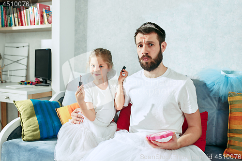 Image of Father and his six years kid girl at home