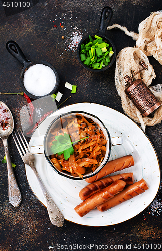 Image of sausages with cabbage