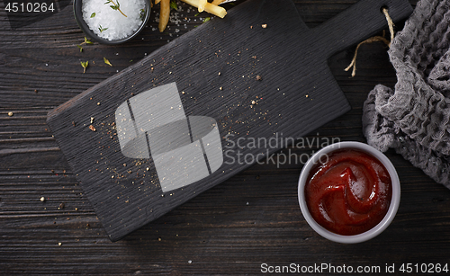 Image of black wooden cutting board