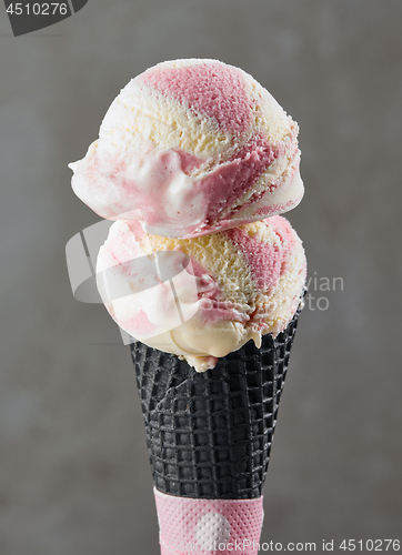 Image of Ice cream balls in black waffle cone