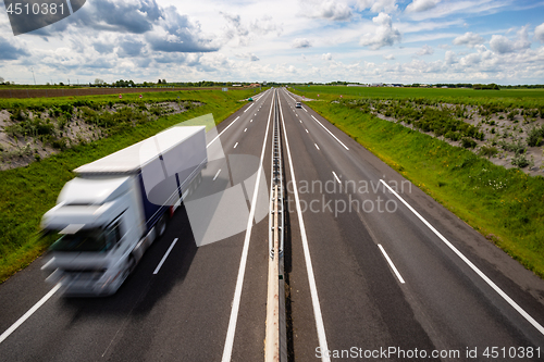 Image of Motion blurred truck on the highway