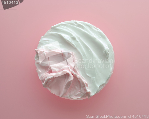 Image of white and pink cosmetic cream