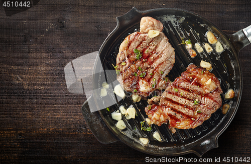 Image of grilled steaks on grilling pan