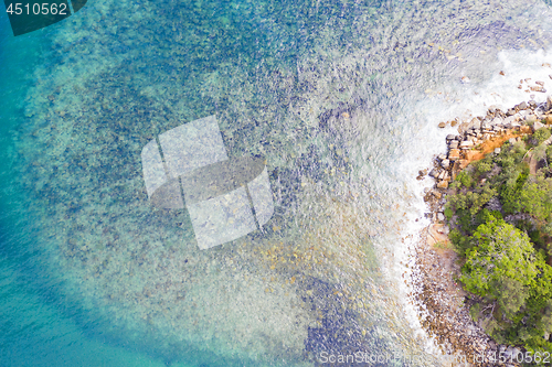 Image of Blue waters rocky cove aerial in Sydney