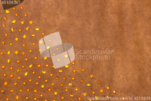 Image of Shiny amber gems on textured leather background