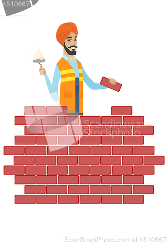 Image of Hindu bricklayer working with spatula and brick.