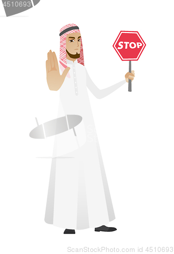 Image of Muslim businessman holding stop road sign.