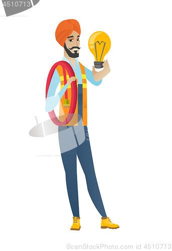Image of Hindu electrician holding bright light bulb.